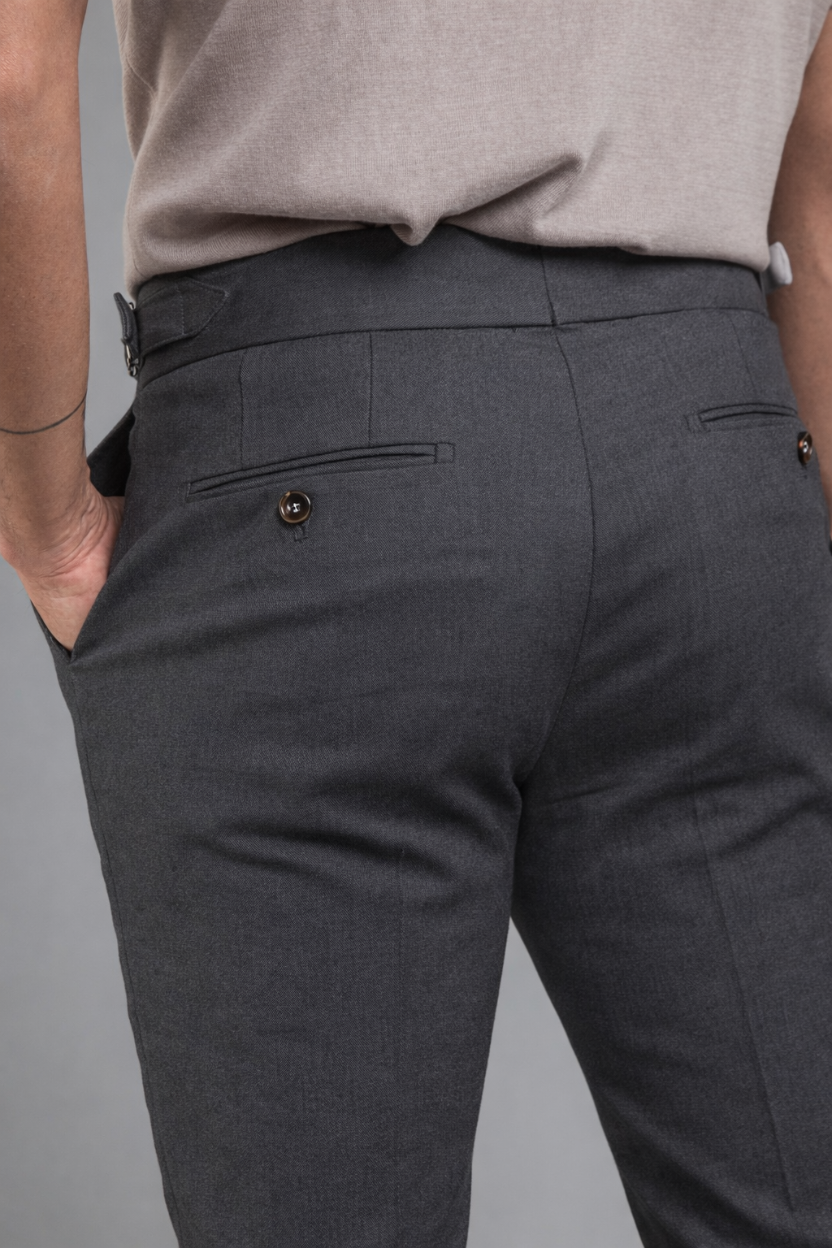 Gray pants worn by a person on a gray background