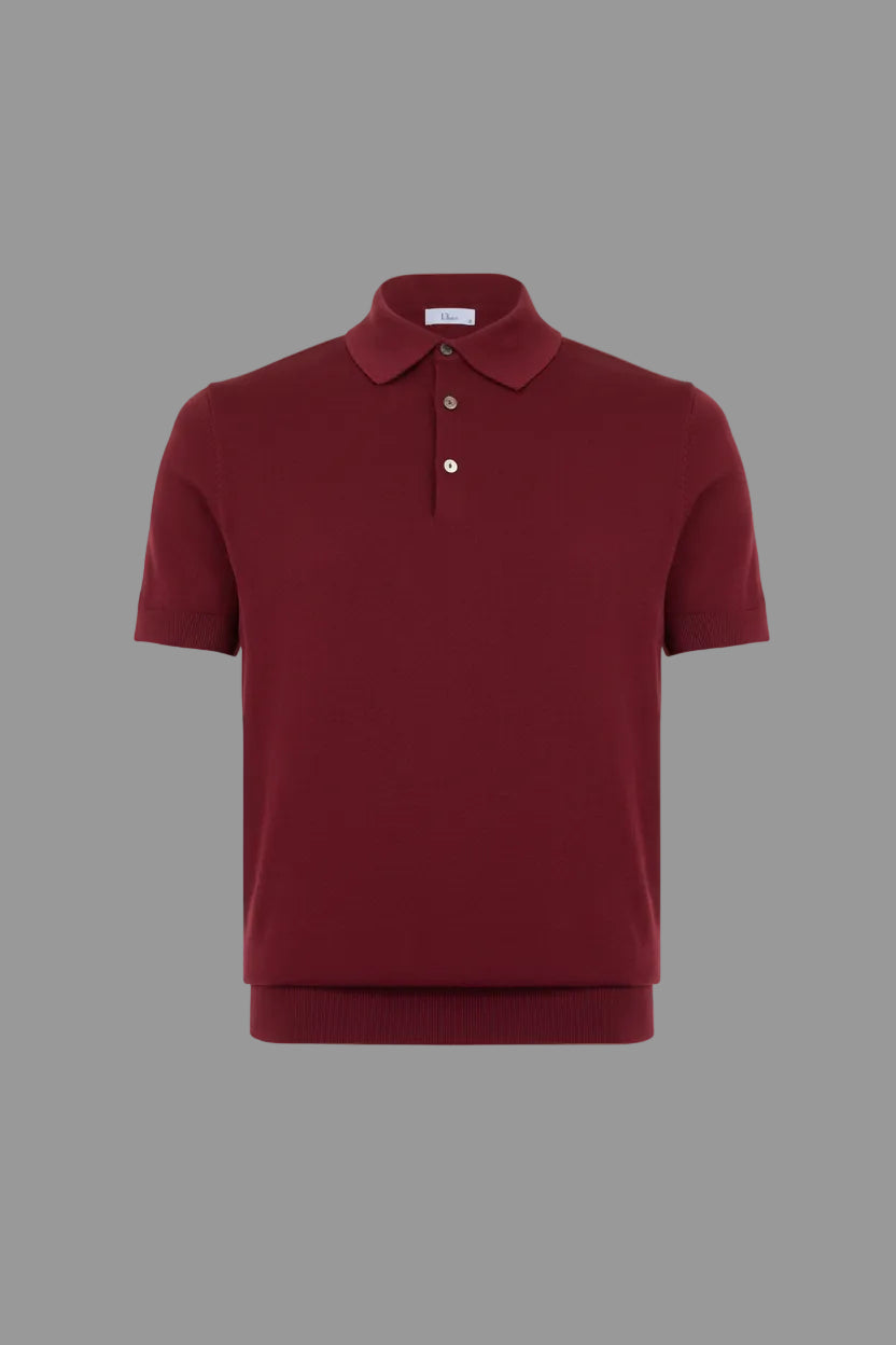 Maroon polo shirt on a light gray background
