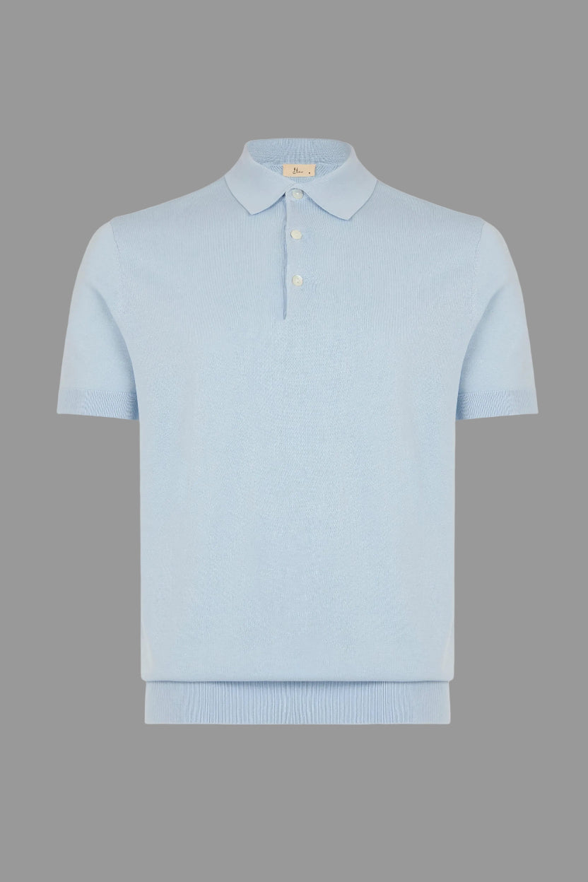 Light blue polo shirt on a gray background