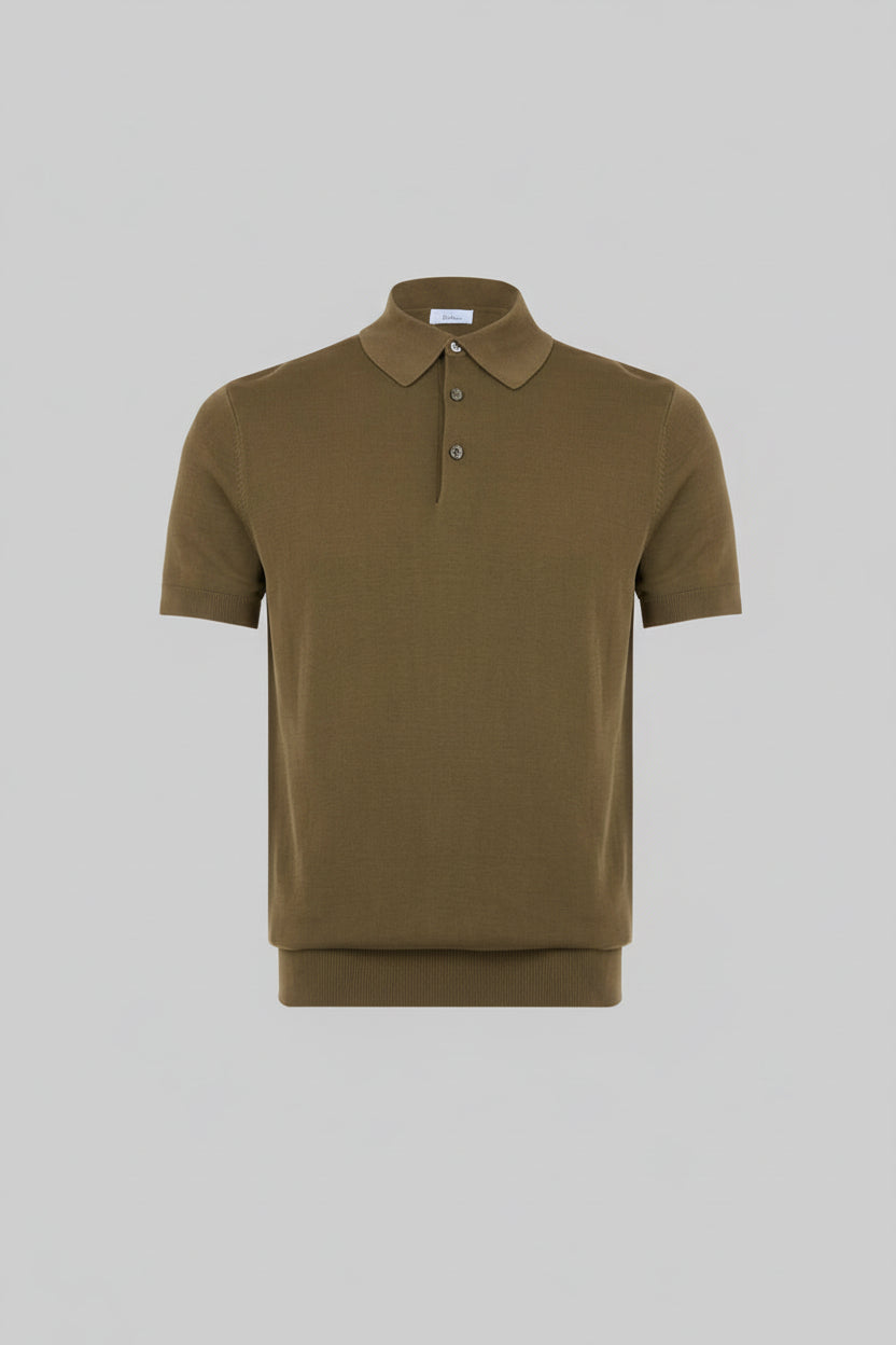 Green polo shirt on a light gray background